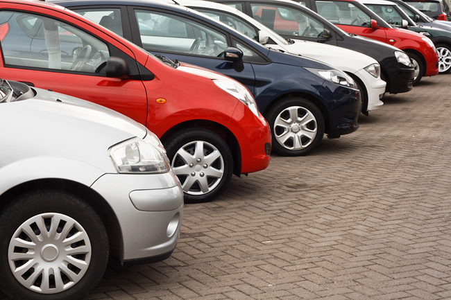 different styles of cars in a row a line up of different types of rental cars